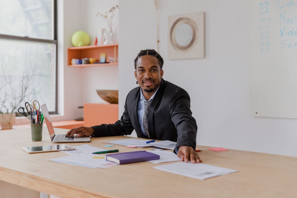 A businessman working at his desk in a bright office
